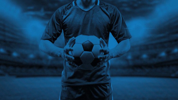blue background of player holding soccer ball in stadium