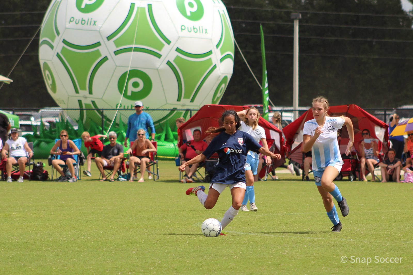Girls playing soccer at Publix SuperCup